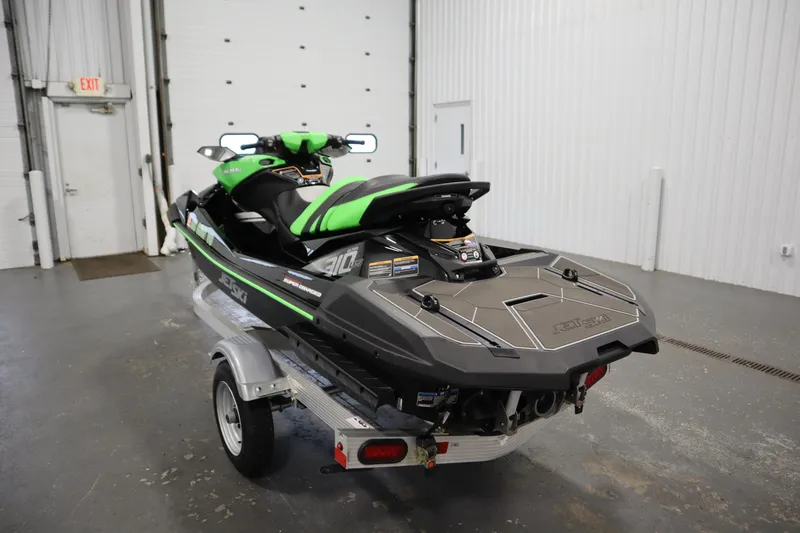 Slide: The Image of 2023 Kawasaki 310LX-S Ultra jet ski on trailer in garage. - 7