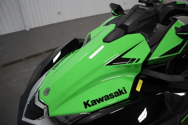 Slide: The Image of 2023 Kawasaki 310LX-S Ultra jet ski, vibrant green and black design, close-up view. - 9