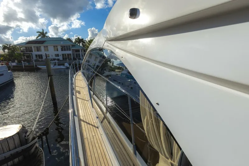 Slide: The Image of 2023 Azimut S6 Sport-Fly yacht docked, showcasing sleek design and luxurious features. - 10