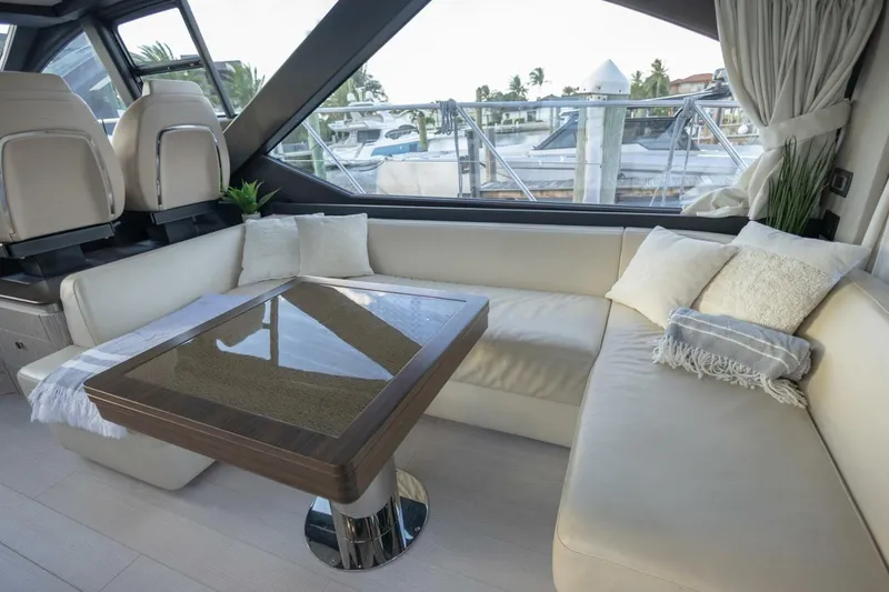 Slide: The Image of Luxurious interior of 2023 Azimut S6 Sport-Fly yacht with elegant seating and table. - 18