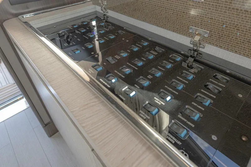 Slide: The Image of Control panel of 2023 Azimut S6 Sport-Fly yacht, featuring multiple switches and sleek design. - 35