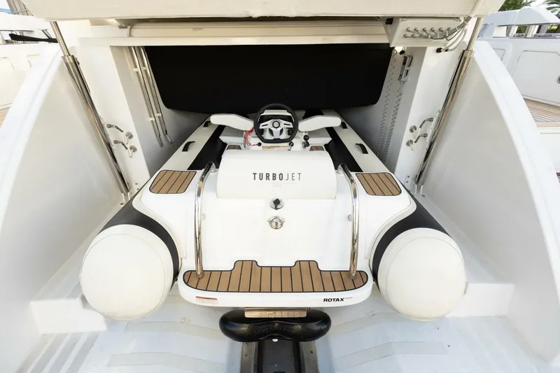 Slide: The Image of 2023 Azimut S6 Sport-Fly yacht with Turbojet tender in storage compartment. - 51