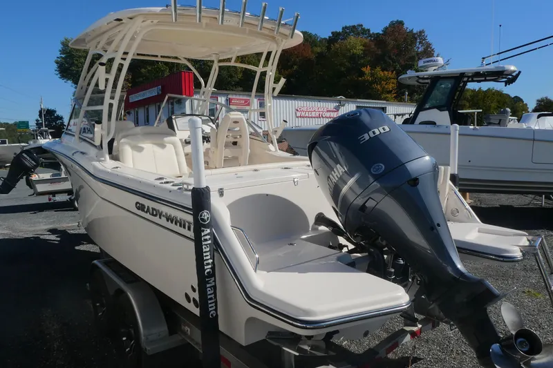 Slide: The Image of 2021 Grady-White Freedom 235 boat with Yamaha 300 engine, displayed outdoors. - 3