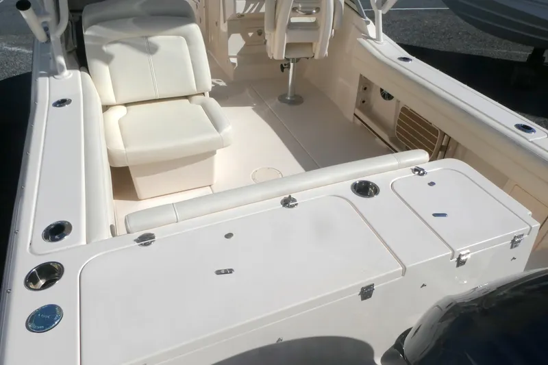 Slide: The Image of 2021 Grady-White Freedom 235 boat interior with seating and storage compartments. - 6