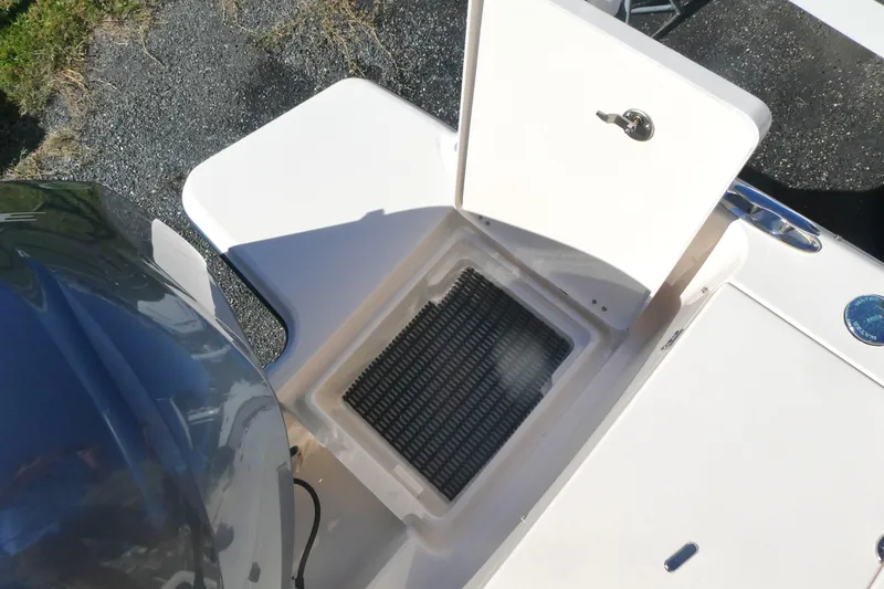 Slide: The Image of 2021 Grady-White Freedom 235 boat with open storage compartment on deck. - 7