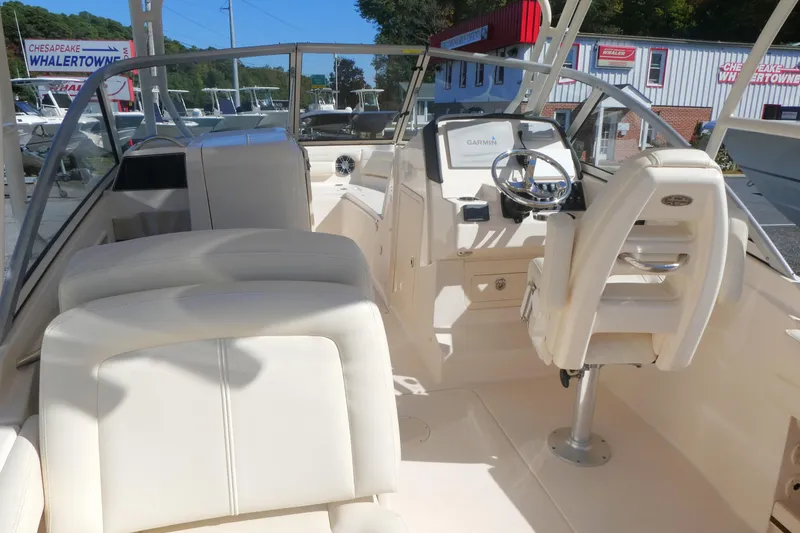 Slide: The Image of 2021 Grady-White Freedom 235 boat interior with helm and seating area. - 9
