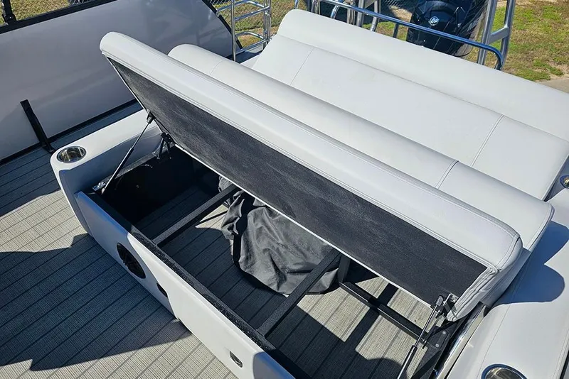 Slide: The Image of 2023 Bentley Pontoons 243 Legacy Swingback with open storage compartment on deck. - 10