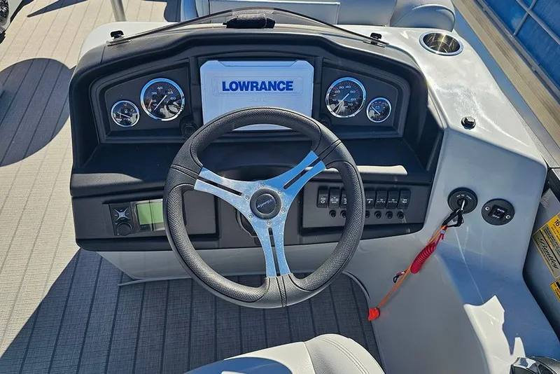 Slide: The Image of 2023 Bentley Pontoons 243 Legacy Swingback Sport3 dashboard with steering wheel and controls. - 14