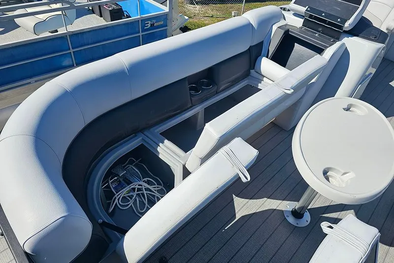 Slide: The Image of 2023 Bentley Pontoons 243 Legacy Swingback interior with seating and storage compartments. - 18