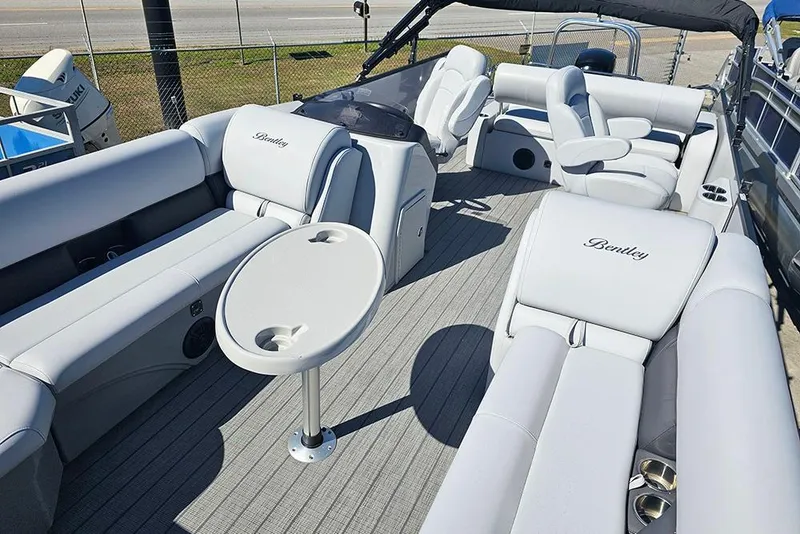 Slide: The Image of 2023 Bentley Pontoons 243 Legacy Swingback Sport3 with luxurious seating and table. - 6
