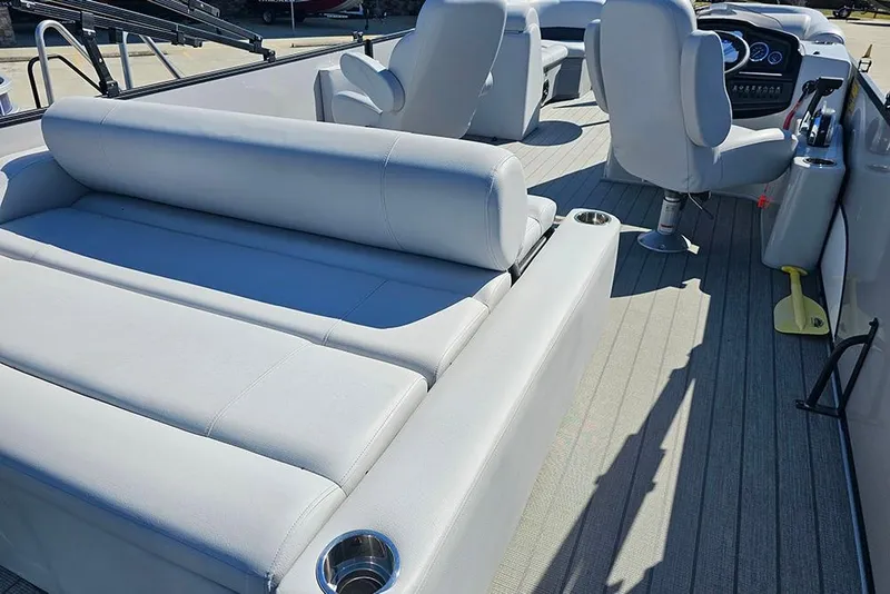 Slide: The Image of 2023 Bentley Pontoons 243 Legacy Swingback interior with plush seating and modern dashboard. - 7