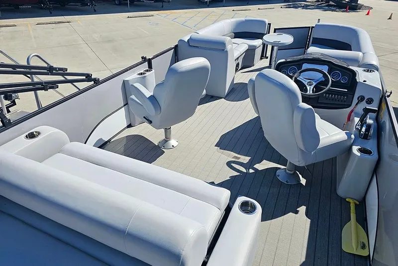 Slide: The Image of 2023 Bentley Pontoons 243 Legacy Swingback interior with luxurious seating and modern dashboard. - 8