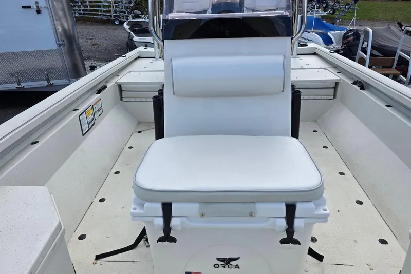 Slide: The Image of 2022 Ranger RB200 boat interior with white seating and Orca cooler. - 12