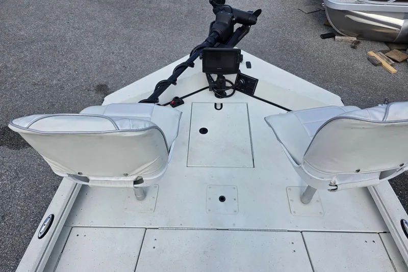 Slide: The Image of 2022 Ranger RB200 boat interior with dual seats and control panel. - 17