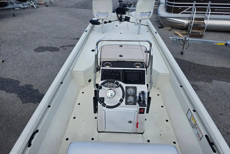 Slide: The Image of 2022 Ranger RB200 boat interior with steering console and seating. - 7