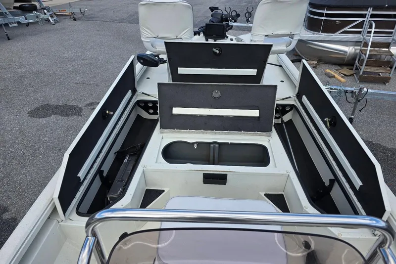 Slide: The Image of 2022 Ranger RB200 boat interior with open storage compartments and seating. - 9