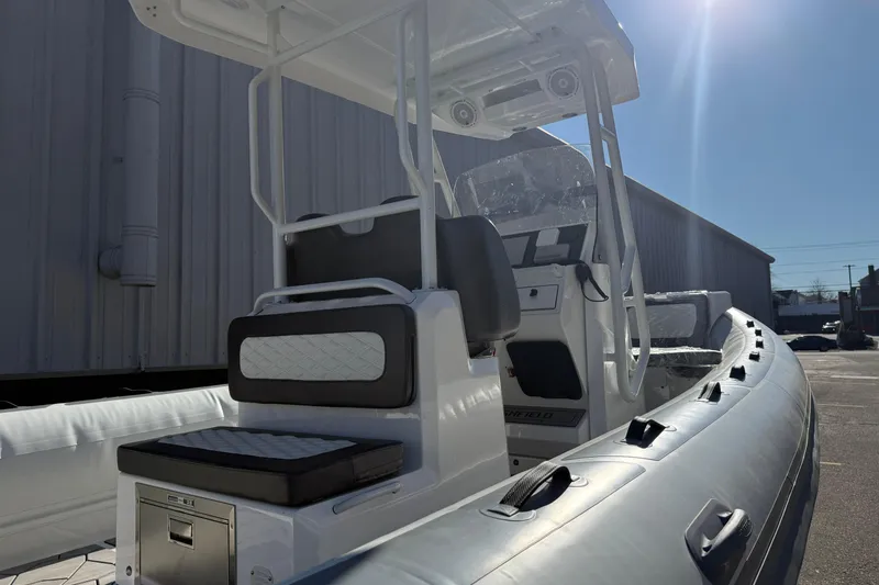Slide: The Image of 2026 Highfield Sport 760 boat with sleek seating and modern design in sunlight. - 10