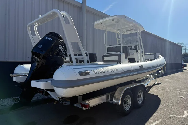 Slide: The Image of 2026 Highfield Sport 760 boat on trailer, featuring a powerful Suzuki 300 engine. - 9