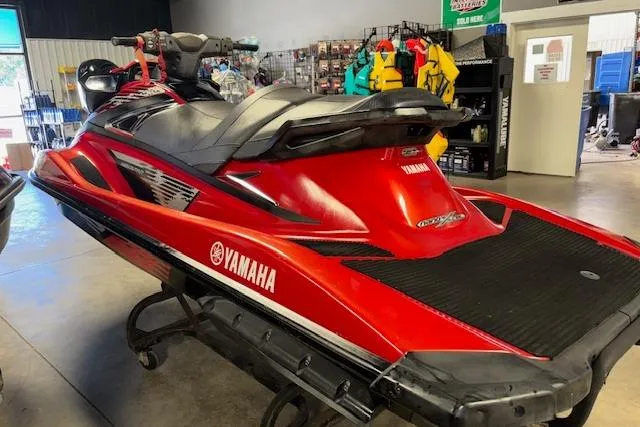 Slide: The Image of 2015 Yamaha WaveRunner VXR in showroom, red and black design, side view. - 6