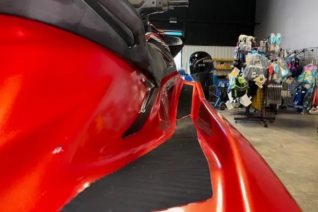 Slide: The Image of Red 2015 Yamaha WaveRunner VXR in showroom, side view with accessories displayed. - 8