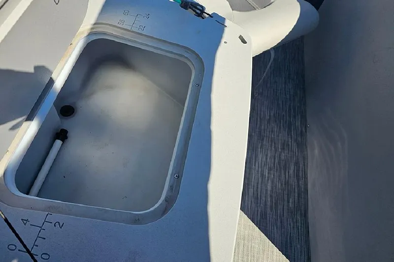 Slide: The Image of 2021 Bennington SX 22 Fishing boat interior with storage compartment. - 11