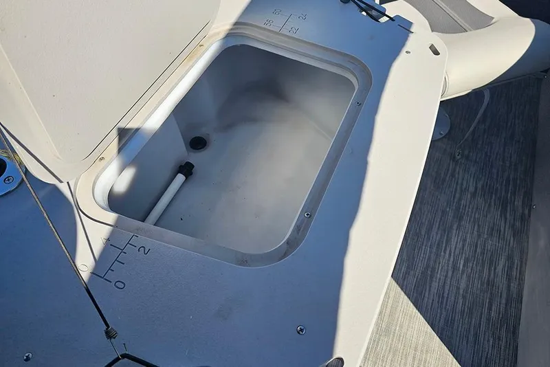 Slide: The Image of Open storage compartment on 2021 Bennington SX 22 Fishing boat deck. - 12