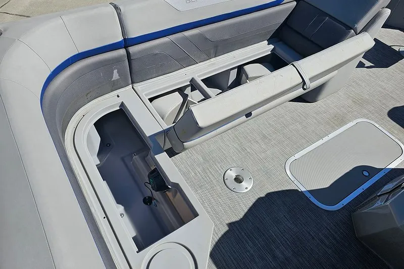 Slide: The Image of 2021 Bennington SX 22 Fishing boat interior with storage compartments and seating. - 18