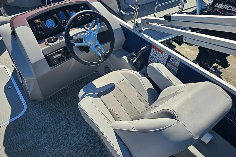 Slide: The Image of 2021 Bennington SX 22 Fishing boat cockpit with steering wheel and comfortable seating. - 19
