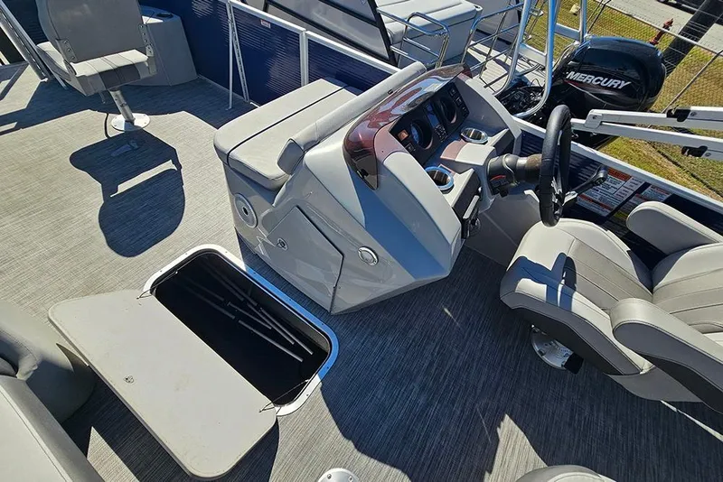 Slide: The Image of 2021 Bennington SX 22 Fishing boat interior with steering console and seating. - 22