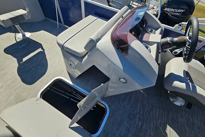 Slide: The Image of 2021 Bennington SX 22 Fishing boat interior with storage compartments and steering console. - 23
