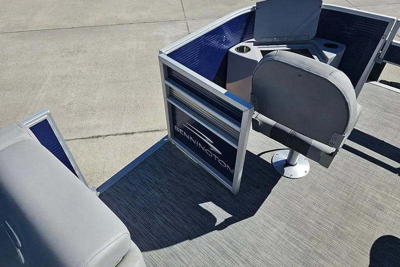 Slide: The Image of 2021 Bennington SX 22 Fishing boat interior with seating and storage compartments. - 27