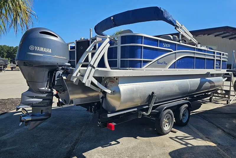 Slide: The Image of 2021 Bennington SX 22 Fishing pontoon boat with Yamaha engine on trailer. - 6