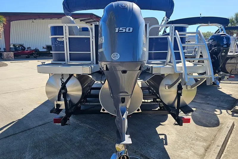 Slide: The Image of 2021 Bennington SX 22 Fishing boat with Yamaha 150 engine, docked outdoors. - 7