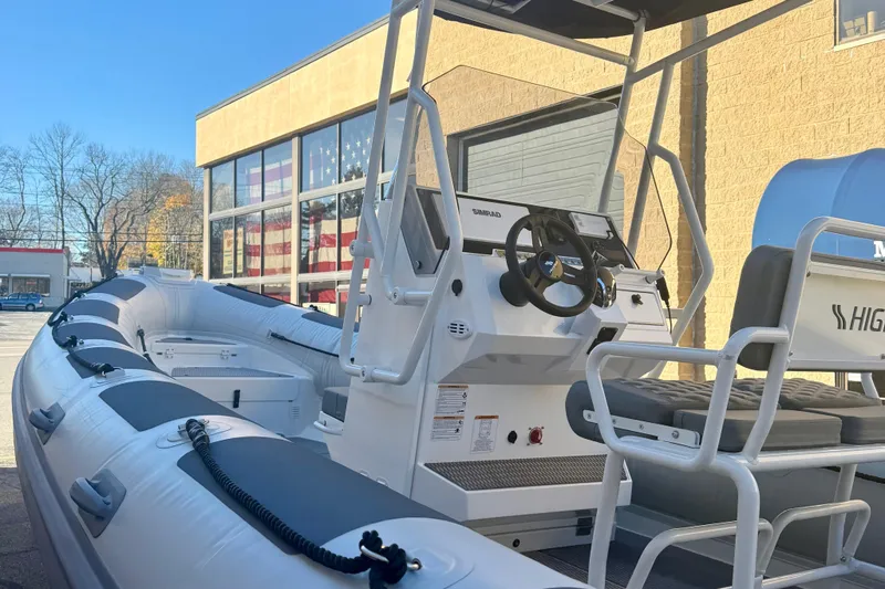 Slide: The Image of 2025 Highfield Patrol 760 boat interior with diamond-stitched seating and modern design. - 10