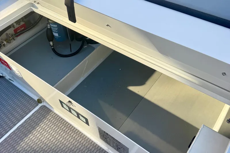 Slide: The Image of Gray cushioned seating on 2025 Highfield Patrol 760 boat, featuring diamond stitching. - 14