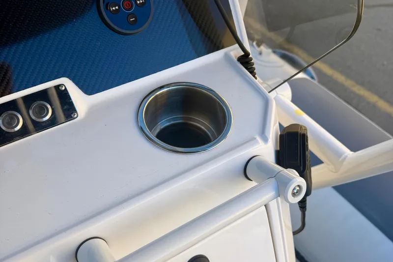 Slide: The Image of 2025 Highfield Patrol 760 boat console with USB port and speaker. - 20
