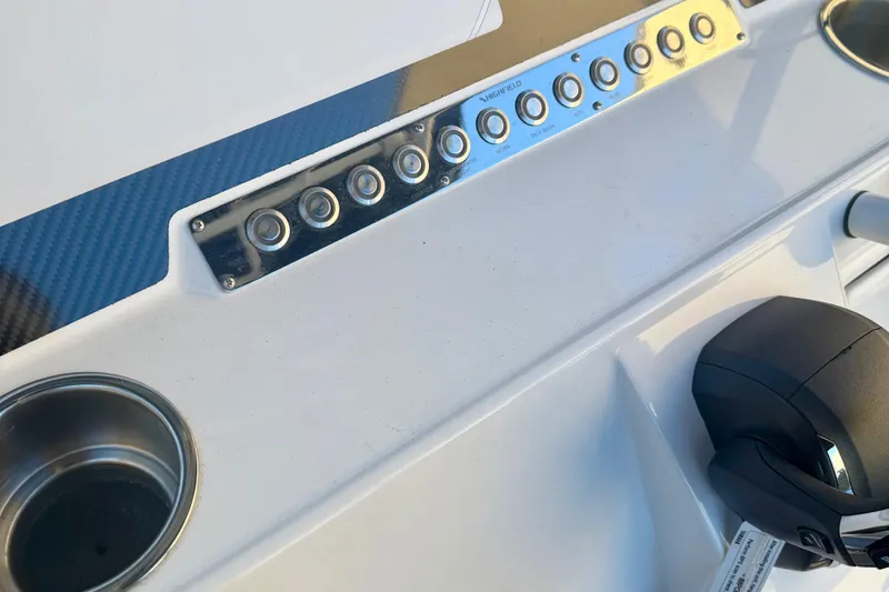 Slide: The Image of 2025 Highfield Patrol 760 boat with gray seating and white inflatable sides. - 21