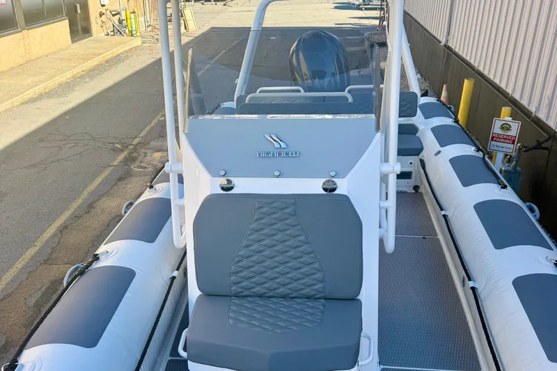 Slide: The Image of Highfield Patrol 760 boat storage compartment, 2025 model, featuring a white and gray interior. - 24