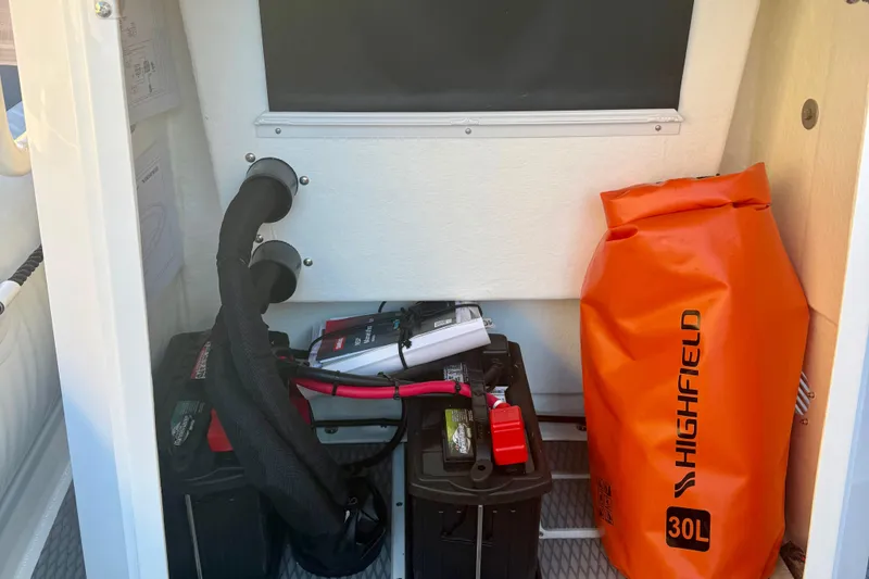 Slide: The Image of 2025 Highfield Patrol 760 boat parked near a marine facility. - 30