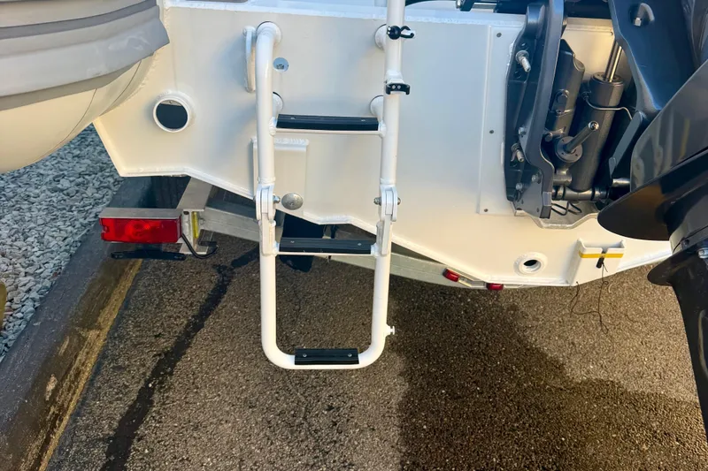 Slide: The Image of 2025 Highfield Patrol 760 boat close-up, showcasing rope detail and steering console. - 9