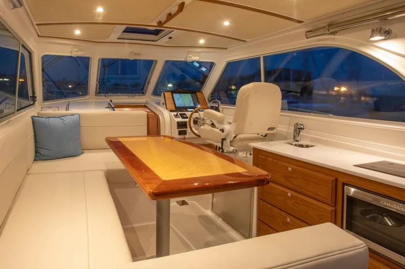 Slide: The Image of Luxurious interior of 2026 Back Cove 340 yacht with elegant seating and modern navigation equipment. - 10