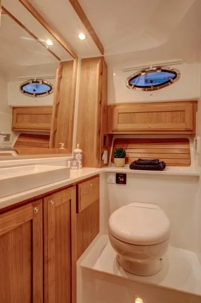 Slide: The Image of Luxurious bathroom in 2026 Back Cove 340 yacht with wooden cabinetry and modern fixtures. - 18