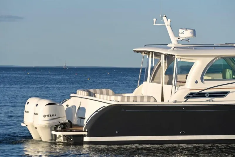 Slide: The Image of 2026 Back Cove 340 boat with Yamaha engine on calm water. - 7