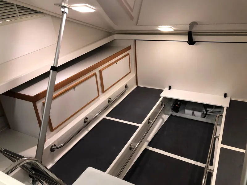 Slide: The Image of 2026 Back Cove 340 interior cabin with sleek storage and modern design. - 21