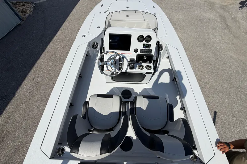 Slide: The Image of 2026 Blazer 675 Ultimate Bay boat interior with dual seats and modern console. - 10