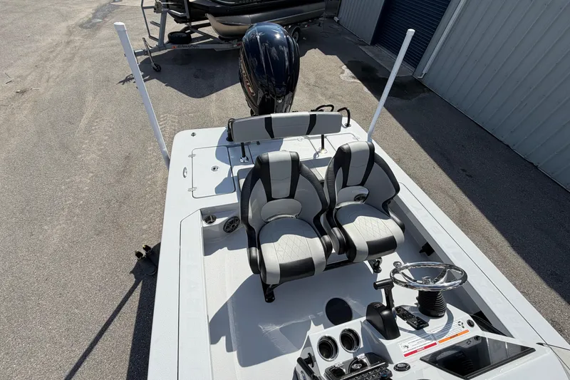 Slide: The Image of 2026 Blazer 675 Ultimate Bay boat interior with dual seats and steering console. - 12