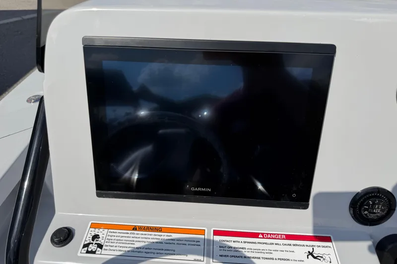 Slide: The Image of 2026 Blazer 675 Ultimate Bay dashboard with Garmin display and safety warnings. - 8