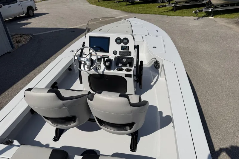 Slide: The Image of 2026 Blazer 675 Ultimate Bay boat interior with dual seats and modern dashboard. - 9