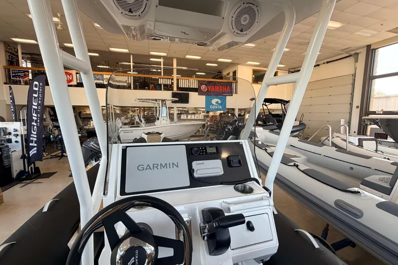 Slide: The Image of Highfield Sport 660 boat interior with Garmin navigation, showroom display, 2026 model. - 18