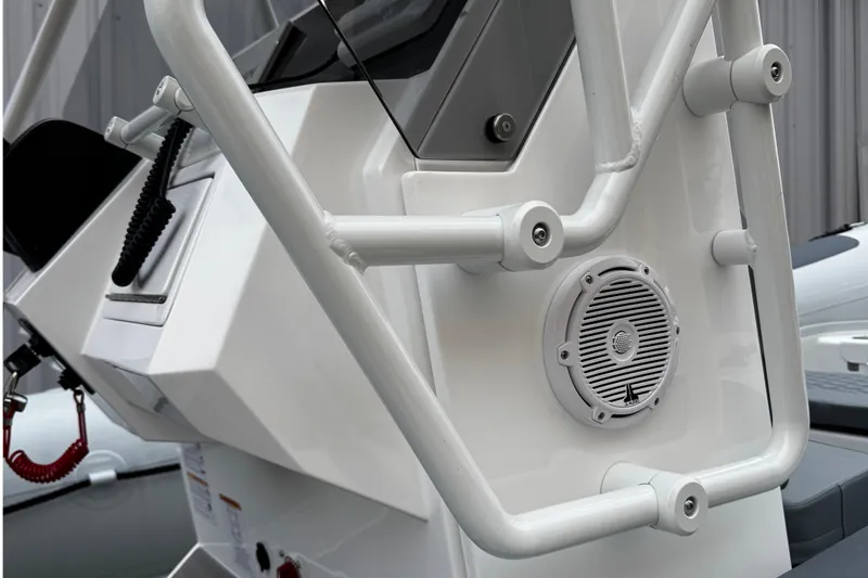 Slide: The Image of 2026 Highfield Patrol 600 boat console with steering wheel and navigation equipment. - 12